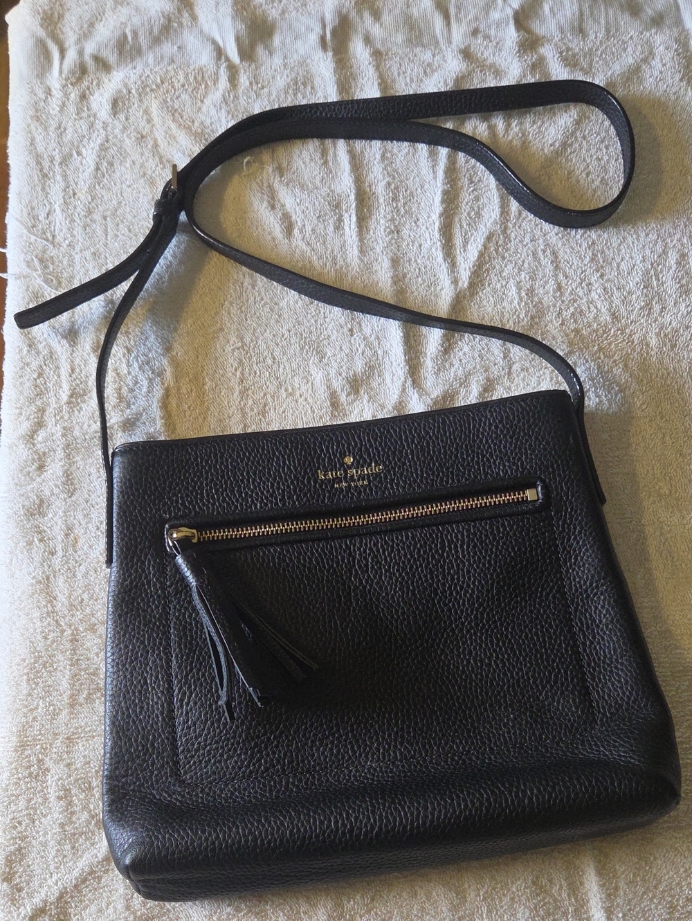 Kate Spade black pebbled leather crossbody with tassel zip